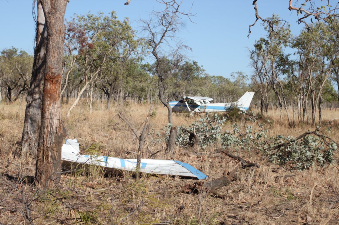 Figure 2: VH-FPZ after the forced landing with part of the left wing in the foreground